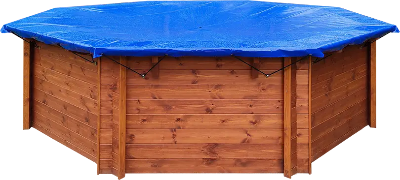Wooden swimming pool with a winter cover on.