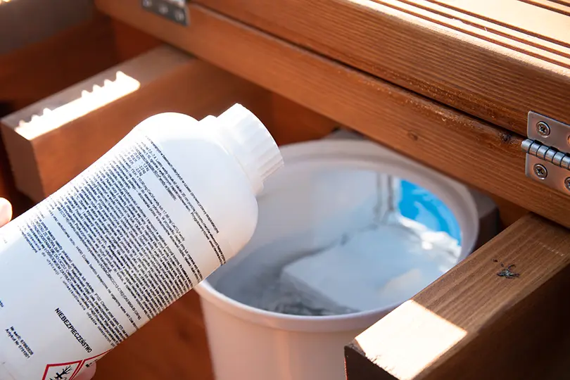 Pool care product being applied through a skimmer.